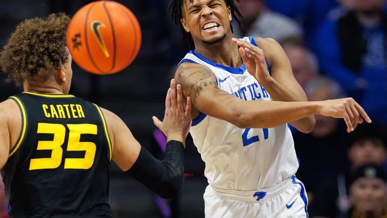 Jan 9, 2024; Lexington, Kentucky, USA; Kentucky Wildcats guard D.J. Wagner (21) passes the ball during the first half against the Missouri Tigers at Rupp Arena at Central Bank Center. Mandatory Credit: Jordan Prather-USA TODAY Sports