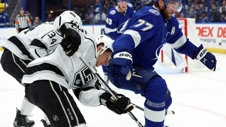 Jan 9, 2024; Tampa, Florida, USA; Tampa Bay Lightning defenseman Victor Hedman (77) defends Los Angeles Kings center Blake Lizotte (46) during the second period at Amalie Arena. Mandatory Credit: Kim Klement Neitzel-USA TODAY Sports