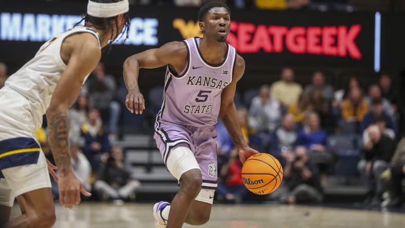 Jan 9, 2024; Morgantown, West Virginia, USA; Kansas State Wildcats guard Cam Carter (5) dribbles the ball during the first half against the West Virginia Mountaineers at WVU Coliseum. Mandatory Credit: Ben Queen-USA TODAY Sports