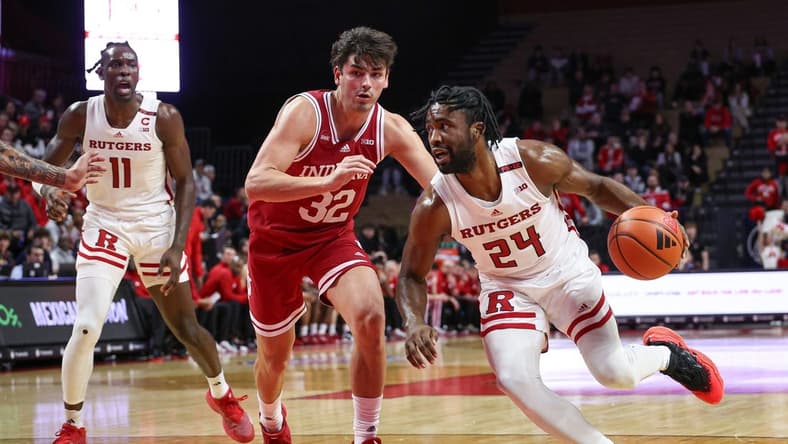 Jan 9, 2024; Piscataway, New Jersey, USA; Rutgers Scarlet Knights guard Austin Williams (24) dribbles against Indiana Hoosiers guard Trey Galloway (32) during the second half at Jersey Mike's Arena. Mandatory Credit: Vincent Carchietta-USA TODAY Sports