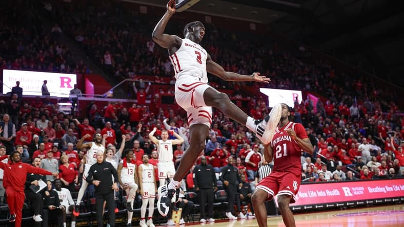 Jan 9, 2024; Piscataway, New Jersey, USA; Rutgers Scarlet Knights forward Mawot Mag (3) dunks the ball in front of Indiana Hoosiers forward Mackenzie Mgbako (21) during the second half at Jersey Mike's Arena. Mandatory Credit: Vincent Carchietta-USA TODAY Sports