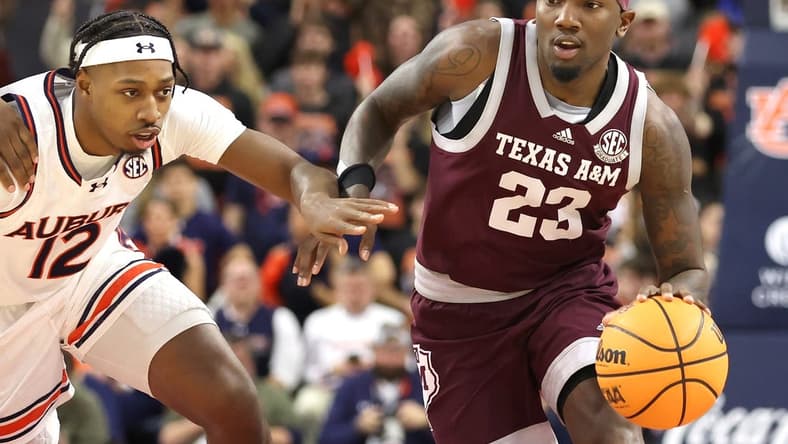 Jan 9, 2024; Auburn, Alabama, USA; Auburn Tigers guard Denver Jones (12) chases Texas A&M Aggies guard Tyrece Radford (23) during the first half at Neville Arena. Mandatory Credit: John Reed-USA TODAY Sports