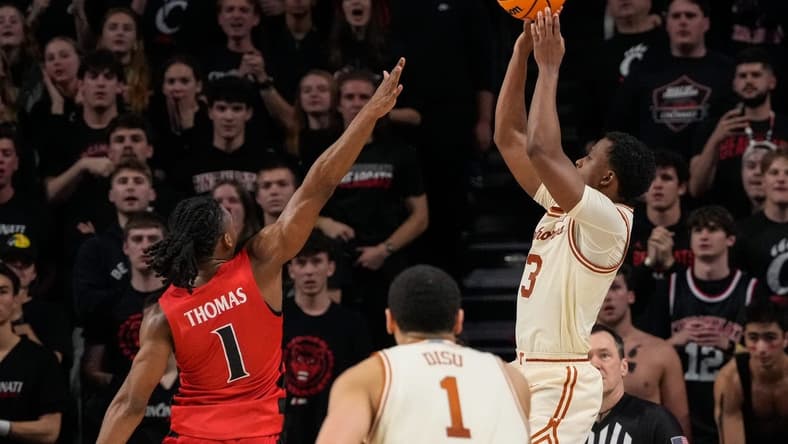 Texas Longhorns guard Max Abmas (3) shoots the go-ahead basket for the win in the second half of the NCAA Big 12 basketball game between the Cincinnati Bearcats and the Texas Longhorns at Fifth Third Arena in Cincinnati on Tuesday, Jan. 9, 2024. Texas pulled off a 74-73 win on a go-ahead basket in the final seconds of the game.