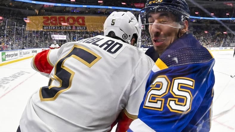 Jan 9, 2024; St. Louis, Missouri, USA;  Florida Panthers defenseman Aaron Ekblad (5) checks St. Louis Blues center Jordan Kyrou (25) during the second period at Enterprise Center. Mandatory Credit: Jeff Curry-USA TODAY Sports