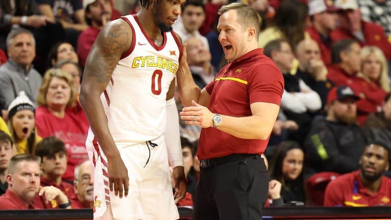 Jan 9, 2024; Ames, Iowa, USA; Iowa State Cyclones head coach TJ Otzelberger talks to Iowa State Cyclones forward Tre King (0) during a timeout during their game with the Houston Cougars at James H. Hilton Coliseum. Mandatory Credit: Reese Strickland-USA TODAY Sports