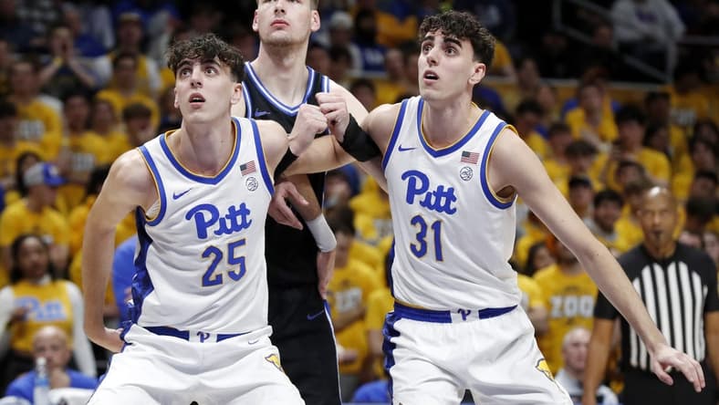 Jan 9, 2024; Pittsburgh, Pennsylvania, USA;  Pittsburgh Panthers twin forwards Guillermo Diaz Graham (25) and Jorge Diaz Graham (31) box out Duke Blue Devils center Kyle Filipowski (middle) during the first half at the Petersen Events Center. Mandatory Credit: Charles LeClaire-USA TODAY Sports