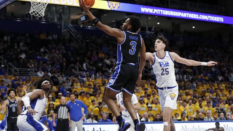 Jan 9, 2024; Pittsburgh, Pennsylvania, USA; Duke Blue Devils guard Jeremy Roach (3) goes to the basket past Pittsburgh Panthers forward Guillermo Diaz Graham (25) during the first half at the Petersen Events Center. Mandatory Credit: Charles LeClaire-USA TODAY Sports