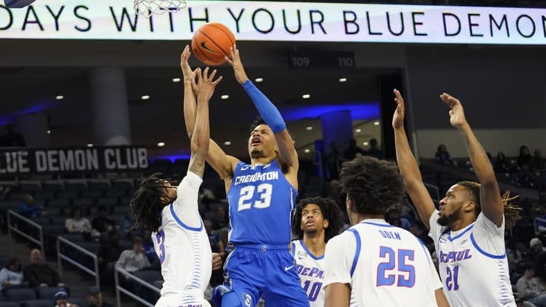 Jan 9, 2024; Chicago, Illinois, USA; DePaul Blue Demons guard Jalen Terry (3) defends Creighton Bluejays guard Trey Alexander (23) during the first half at Wintrust Arena. Mandatory Credit: David Banks-USA TODAY Sports