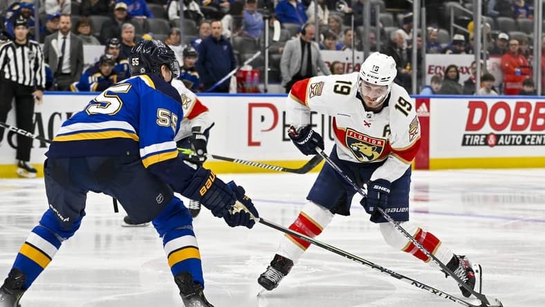 Jan 9, 2024; St. Louis, Missouri, USA;  Florida Panthers left wing Matthew Tkachuk (19) controls the puck as St. Louis Blues defenseman Colton Parayko (55) defends during the third period at Enterprise Center. Mandatory Credit: Jeff Curry-USA TODAY Sports