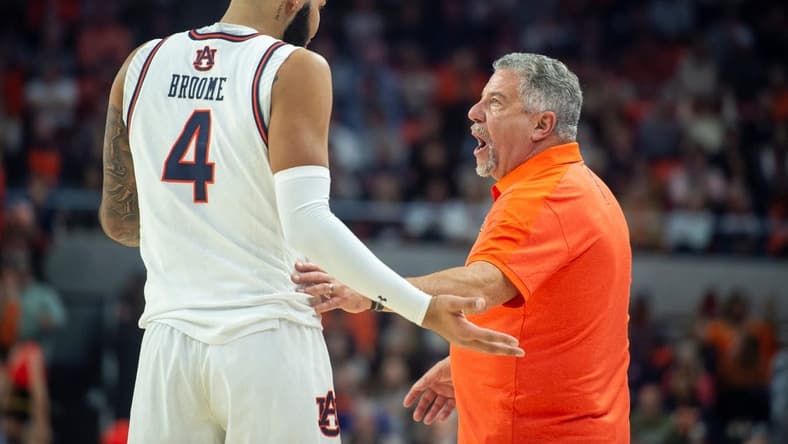 Auburn Tigers center Johni Broome (4) talks with Auburn Tigers head coach Bruce Pearl as Auburn Tigers take on Texas A&M Aggies at Neville Arena in Auburn, Ala., on Tuesday, Jan. 9, 2024. Auburn Tigers defeated Texas A&M Aggies 66-55.