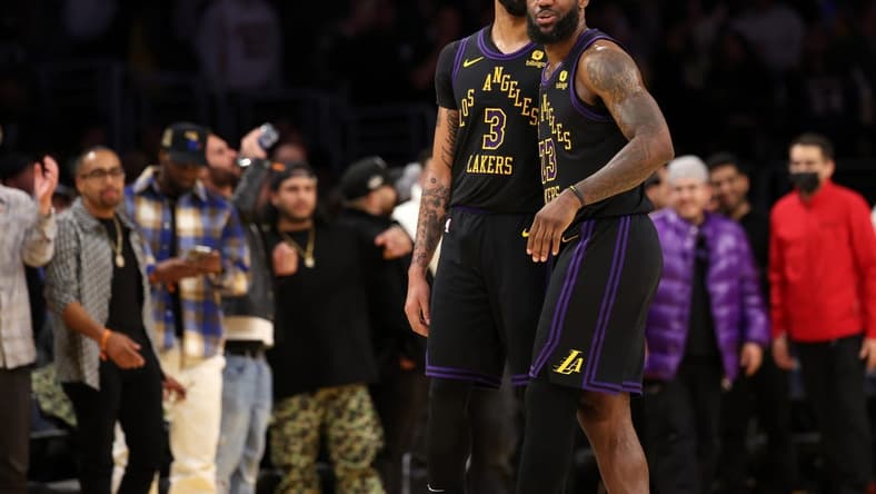 Jan 9, 2024; Los Angeles, California, USA; Los Angeles Lakers forward LeBron James (23) celebrates a victory with forward Anthony Davis (3) after defeating the Toronto Raptors at Crypto.com Arena. Mandatory Credit: Kiyoshi Mio-USA TODAY Sports
