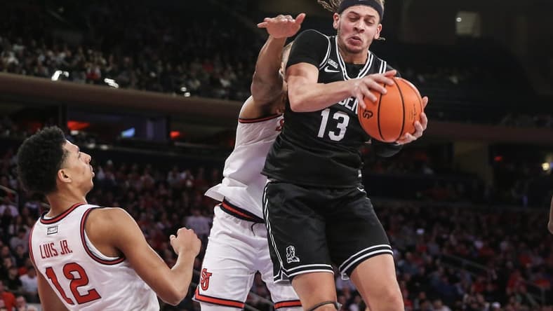 Jan 10, 2024; New York, New York, USA; Providence Friars forward Josh Oduro (13) grabs a rebound in the first half against the St. John's Red Storm at Madison Square Garden. Mandatory Credit: Wendell Cruz-USA TODAY Sports