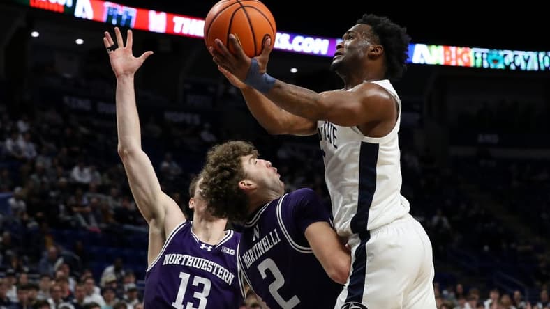 Jan 10, 2024; University Park, Pennsylvania, USA; Penn State Nittany Lions guard Kanye Clary (0) drives the ball to the basket while being fouled by Northwestern Wildcats forward Nick Martinelli (2) during the first half at Bryce Jordan Center. Mandatory Credit: Matthew O'Haren-USA TODAY Sports