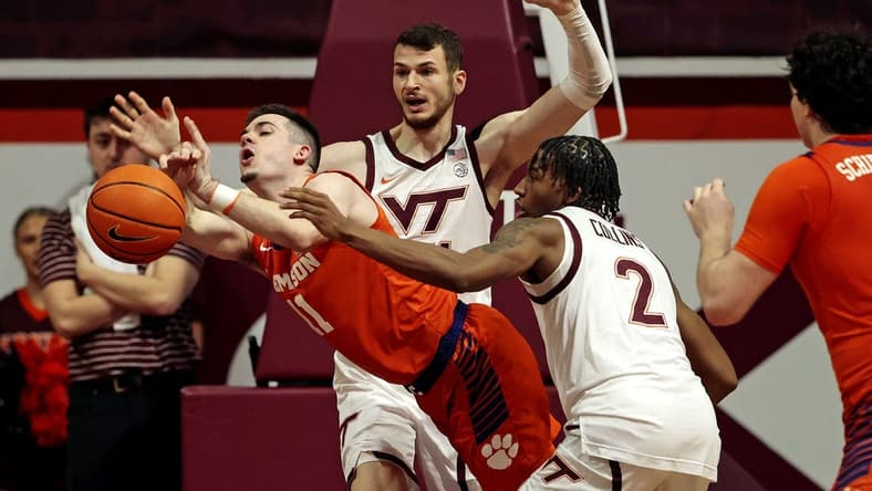 Jan 10, 2024; Blacksburg, Virginia, USA; Virginia Tech Hokies guard MJ Collins (2) knocks the ball away from Clemson Tigers guard Joseph Girard III (11) during the second half at Cassell Coliseum. Mandatory Credit: Peter Casey-USA TODAY Sports