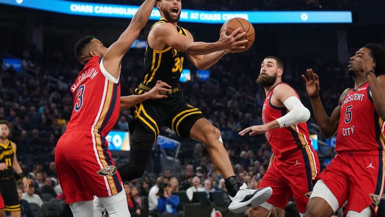 Jan 10, 2024; San Francisco, California, USA; Golden State Warriors guard Stephen Curry (30) attempts a shot next to New Orleans Pelicans guard CJ McCollum (3) in the first quarter at the Chase Center. Mandatory Credit: Cary Edmondson-USA TODAY Sports