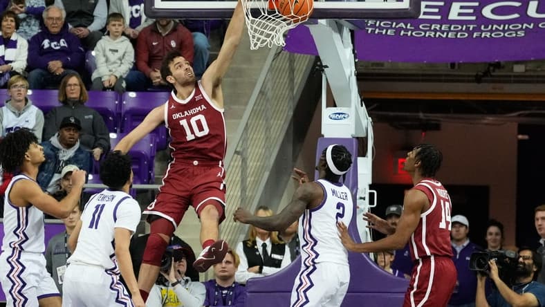 Jan 10, 2024; Fort Worth, Texas, USA; Oklahoma Sooners forward Sam Godwin (10) dunks the ball past TCU Horned Frogs guard Trevian Tennyson (11) during the first half at Ed and Rae Schollmaier Arena. Mandatory Credit: Chris Jones-USA TODAY Sports