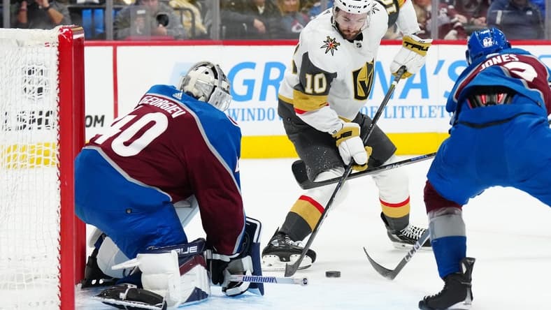 Jan 10, 2024; Denver, Colorado, USA; Vegas Golden Knights center Nicolas Roy (10) shoots the puck in Colorado Avalanche goaltender Alexandar Georgiev (40) in the first period at Ball Arena. Mandatory Credit: Ron Chenoy-USA TODAY Sports