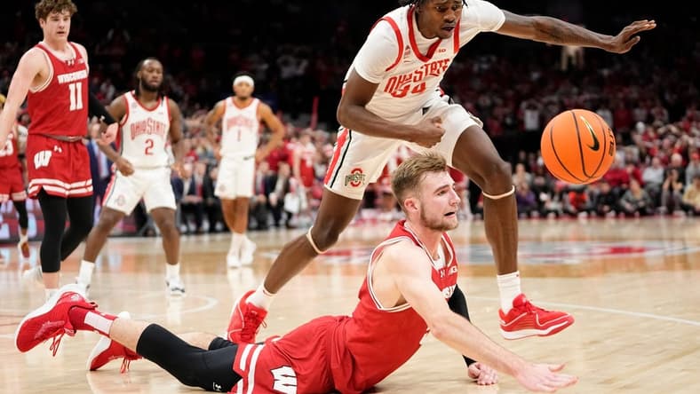 Jan 10, 2024; Columbus, Ohio, USA; Wisconsin Badgers forward Tyler Wahl (5) and Ohio State Buckeyes center Felix Okpara (34) race for a loose ball during the second half of the NCAA men s basketball game at Value City Arena. Ohio State lost 71-60.