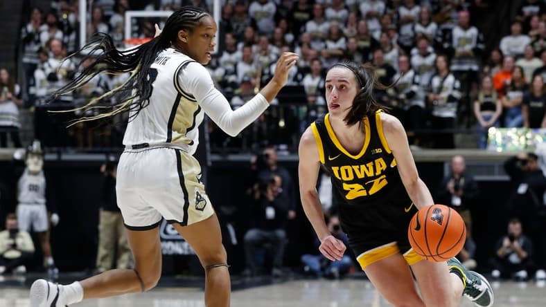 Iowa Hawkeyes guard Caitlin Clark (22) shakes Purdue's Jayla Smith at sold out Mackey Arena on Wednesday, Jan. 10.