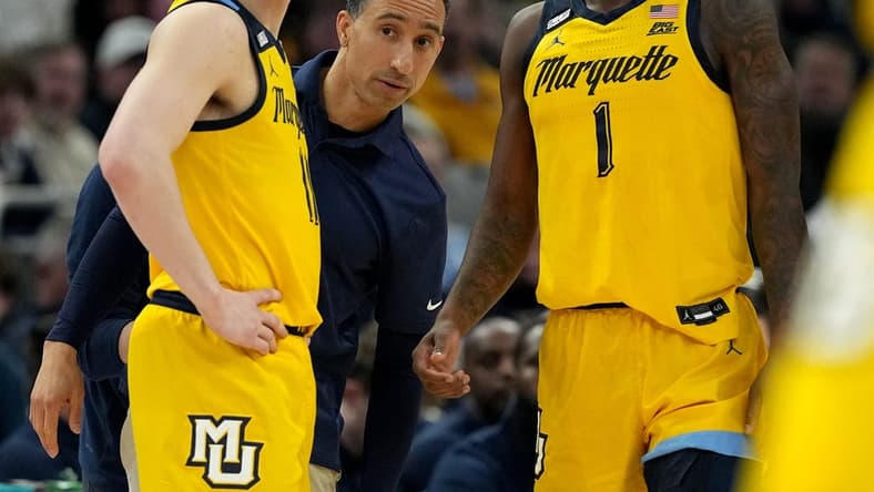 Marquette head coach Shaka Smart talks with guard Tyler Kolek (11) and guard Kam Jones (1) during the first half of their game against Butler Wednesday, January 10, 2024 at Fiserv Forum in Milwaukee, Wisconsin.