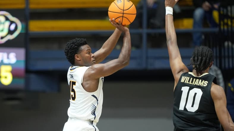 Jan 10, 2024; Berkeley, California, USA; California Golden Bears guard Jalen Cone (15) shoots against Colorado Buffaloes forward Cody Williams (10) during the first half at Haas Pavilion. Mandatory Credit: Darren Yamashita-USA TODAY Sports