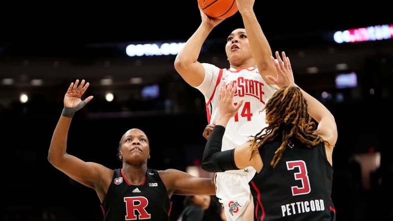 Jan 11, 2024; Columbus, Ohio, USA; Ohio State Buckeyes forward Taiyier Parks (14) shoots over Rutgers Scarlet Knights guard Mya Petticord (3) and Rutgers Scarlet Knights center Chyna Cornwell (54) during the second half of the NCAA women   s basketball game at Value City Arena. Ohio State won 90-55.