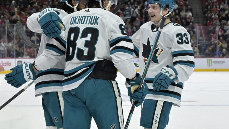 Jan 11, 2024; Montreal, Quebec, CAN; San Jose Sharks defenseman Nikita Okhotiuk (83) celebrates with teammates including defenseman Calen Addison (33) and forward Anthony Duclair (10) after scoring a goal against the Montreal Canadiens during the second period at the Bell Centre. Mandatory Credit: Eric Bolte-USA TODAY Sports