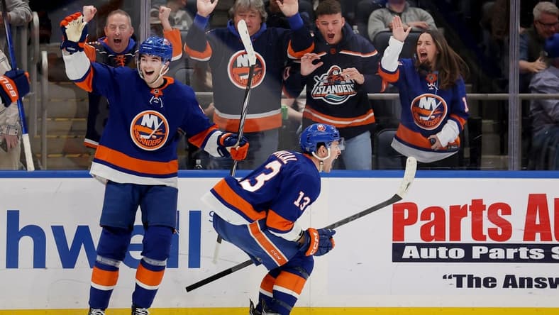 Jan 11, 2024; Elmont, New York, USA; New York Islanders center Mathew Barzal (13) celebrates his game winning goal against the Toronto Maple Leafs with defenseman Noah Dobson (8) during overtime at UBS Arena. Mandatory Credit: Brad Penner-USA TODAY Sports