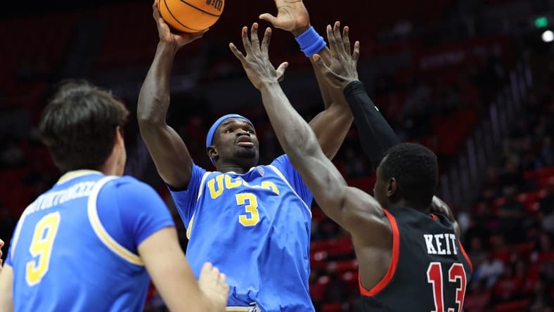 Jan 11, 2024; Salt Lake City, Utah, USA; UCLA Bruins forward Adem Bona (3) goes to the basket against Utah Utes center Keba Keita (13) during the first half at Jon M. Huntsman Center. Mandatory Credit: Rob Gray-USA TODAY Sports