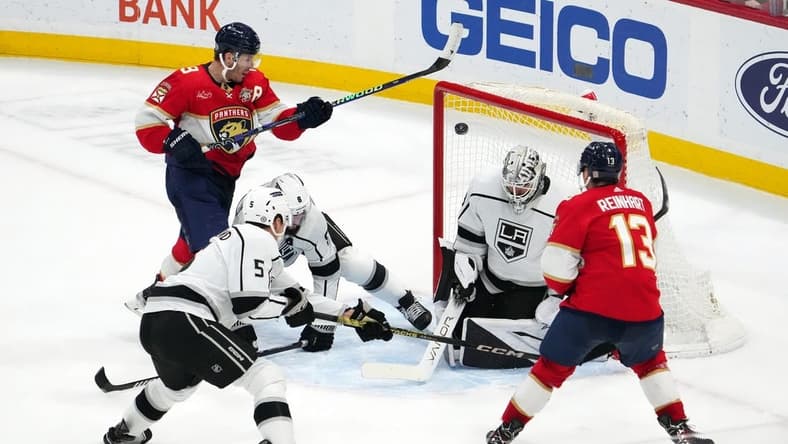 Jan 11, 2024; Sunrise, Florida, USA; Florida Panthers center Sam Reinhart (13) scores the game winning goal past Los Angeles Kings goaltender Cam Talbot (39) with 00.7 seconds left in the overtime period at Amerant Bank Arena. Mandatory Credit: Jasen Vinlove-USA TODAY Sports