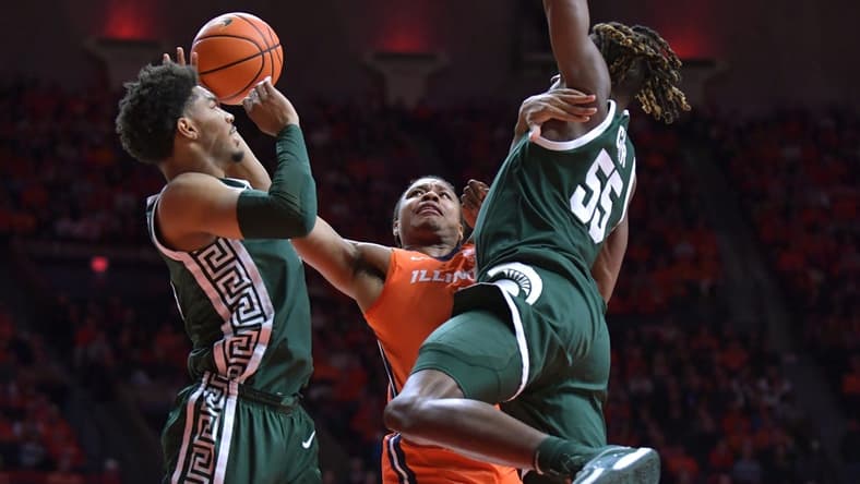 Jan 11, 2024; Champaign, Illinois, USA; Illinois Fighting Illini guard Justin Harmon (4) drives to the basket during the first half against the Michigan State Spartans at State Farm Center. Mandatory Credit: Ron Johnson-USA TODAY Sports