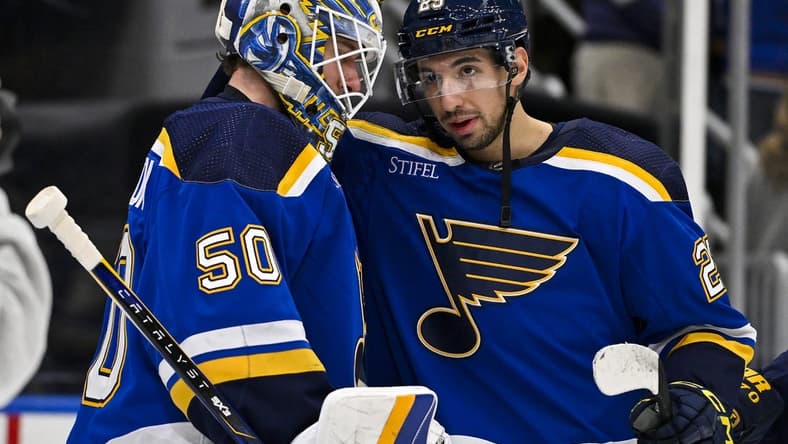Jan 11, 2024; St. Louis, Missouri, USA;  St. Louis Blues center Jordan Kyrou (25) and goaltender Jordan Binnington (50) celebrate after the Blues defeated the New York Rangers at Enterprise Center. Mandatory Credit: Jeff Curry-USA TODAY Sports