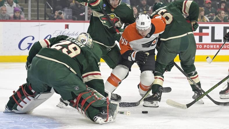Jan 12, 2024; Saint Paul, Minnesota, USA; Philadelphia Flyers forward Cam Atkinson (89) hunts for a rebound as Minnesota Wild defenseman Jon Merrill (4) and defenseman Dakota Mermis (6) defend in front of goalie Marc-Andre Fleury (29) during the first period at Xcel Energy Center. Mandatory Credit: Nick Wosika-USA TODAY Sports