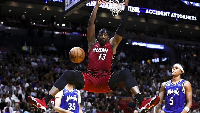 Jan 12, 2024; Miami, Florida, USA; Miami Heat center Bam Adebayo (13) dunks the basketball against the Orlando Magic during the second quarter at Kaseya Center. Mandatory Credit: Sam Navarro-USA TODAY Sports