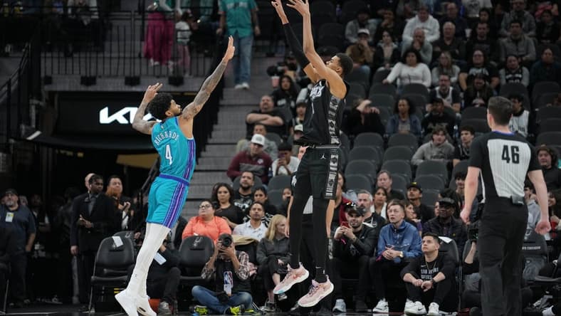 Jan 12, 2024; San Antonio, Texas, USA; San Antonio Spurs center Victor Wembanyama (1) shoots over Charlotte Hornets center Nick Richards (4) in the first half at Frost Bank Center. Mandatory Credit: Daniel Dunn-USA TODAY Sports