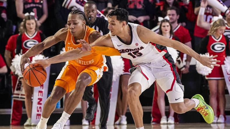 Jan 13, 2024; Athens, Georgia, USA; Tennessee Volunteers guard Jordan Gainey (2) and Georgia Bulldogs guard RJ Melendez (15) fight for the ball during the first half at Stegeman Coliseum. Mandatory Credit: Dale Zanine-USA TODAY Sports