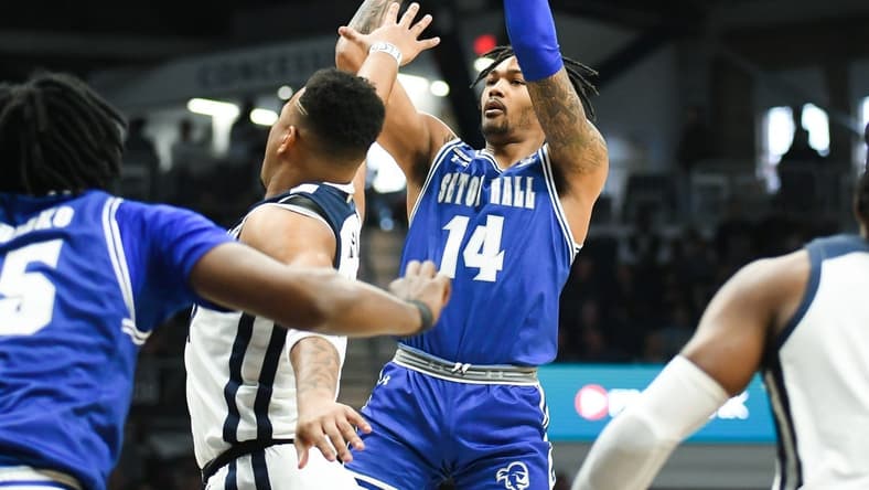 Jan 13, 2024; Indianapolis, Indiana, USA; Seton Hall Pirates guard Dre Davis (14) attempts a shot over Butler Bulldogs guard Pierre Brooks (21) during the first half at Hinkle Fieldhouse. Mandatory Credit: Robert Goddin-USA TODAY Sports