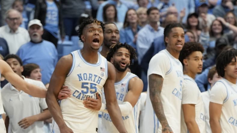Jan 13, 2024; Chapel Hill, North Carolina, USA; North Carolina Tar Heels bench including forward Harrison Ingram (55) and guard RJ Davis (4) and forward Armando Bacot (5) and guard Seth Trimble (7) celebrate in the second half at Dean E. Smith Center. Mandatory Credit: Bob Donnan-USA TODAY Sports