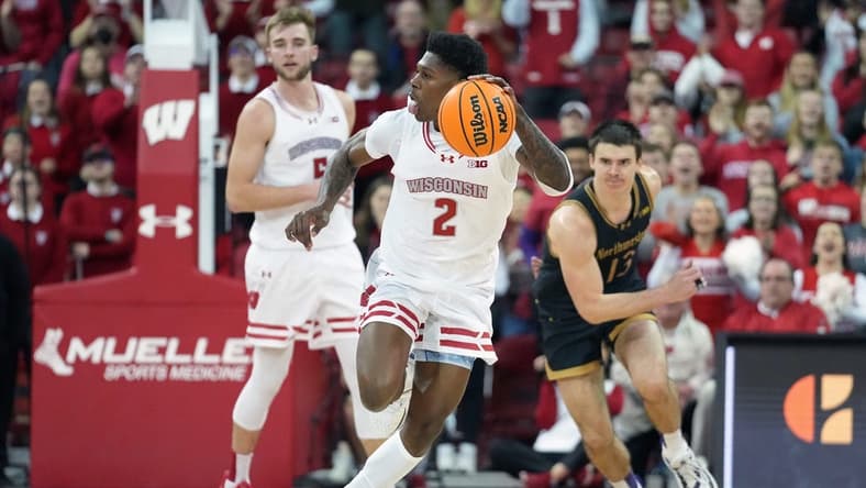 Jan 13, 2024; Madison, Wisconsin, USA; Wisconsin Badgers guard AJ Storr (2) dribbles the ball down the court following a turnover against Northwestern Wildcats during the second half at the Kohl Center. Mandatory Credit: Kayla Wolf-USA TODAY Sports