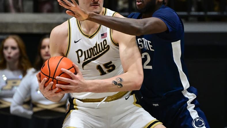Jan 13, 2024; West Lafayette, Indiana, USA; Purdue Boilermakers center Zach Edey (15) controls the ball against Penn State Nittany Lions forward Qudus Wahab (22) during the first half at Mackey Arena. Mandatory Credit: Marc Lebryk-USA TODAY Sports