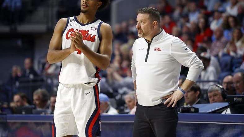 Jan 13, 2024; Oxford, Mississippi, USA; Mississippi Rebels head coach Chris Beard (right) talks with forward Jaemyn Brakefield (4) during the second half against the Vanderbilt Commodores at The Sandy and John Black Pavilion at Ole Miss. Mandatory Credit: Petre Thomas-USA TODAY Sports