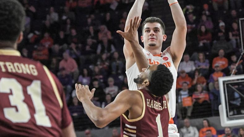 Jan 13, 2024; Clemson, South Carolina, USA; Clemson Tigers guard Joseph Girard III shoots the ball against Boston College Eagles guard Claudell Harris Jr. (1) during the first half at Littlejohn Coliseum. Mandatory Credit: Ken Ruinard-USA TODAY Sports