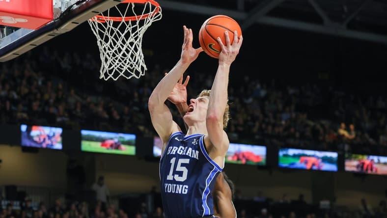 Jan 13, 2024; Orlando, Florida, USA; Brigham Young Cougars guard Richie Saunders (15) goes to the basket during the first period against the UCF Knights at Addition Financial Arena. Mandatory Credit: Mike Watters-USA TODAY Sports