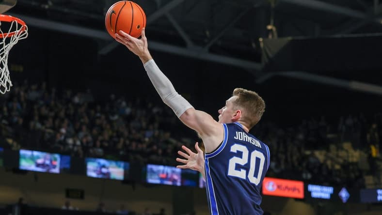 Jan 13, 2024; Orlando, Florida, USA; Brigham Young Cougars guard Spencer Johnson (20) goes to the basket during the first period against the UCF Knights at Addition Financial Arena. Mandatory Credit: Mike Watters-USA TODAY Sports