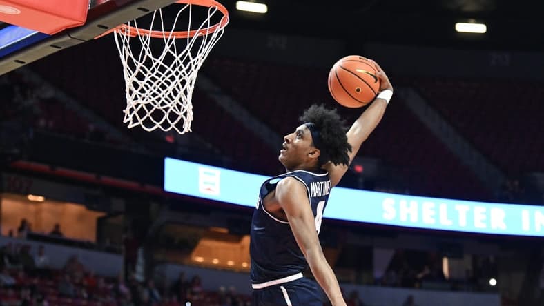Jan 13, 2024; Las Vegas, Nevada, USA; Utah State Aggies guard Ian Martinez (4) dunks on the UNLV Rebels in the second half at Thomas & Mack Center. Mandatory Credit: Candice Ward-USA TODAY Sports