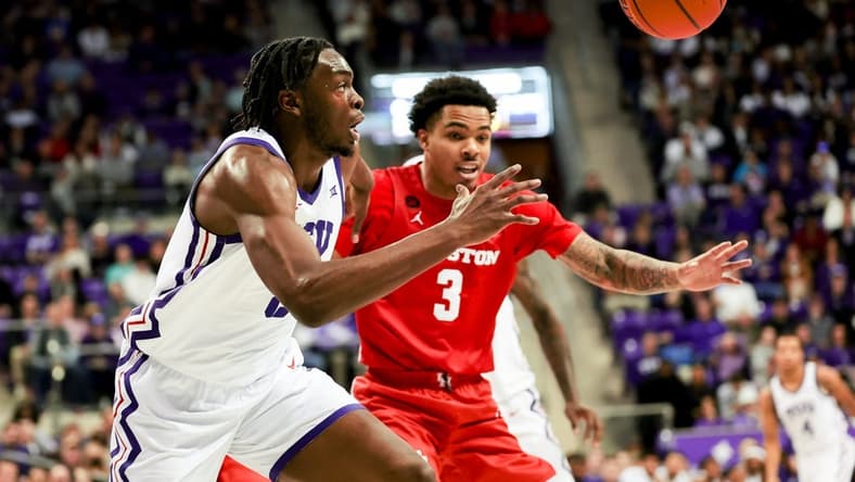 Jan 13, 2024; Fort Worth, Texas, USA; TCU Horned Frogs center Ernest Udeh Jr. (8) and Houston Cougars guard Ramon Walker Jr. (3) go for a loose ball during the first half at Ed and Rae Schollmaier Arena. Mandatory Credit: Kevin Jairaj-USA TODAY Sports