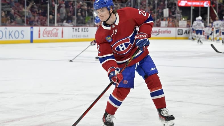 Jan 13, 2024; Montreal, Quebec, CAN; Montreal Canadiens forward Cole Caufield (22) shoots a puck during the warmup period before the game against the Edmonton Oilers at the Bell Centre. Mandatory Credit: Eric Bolte-USA TODAY Sports