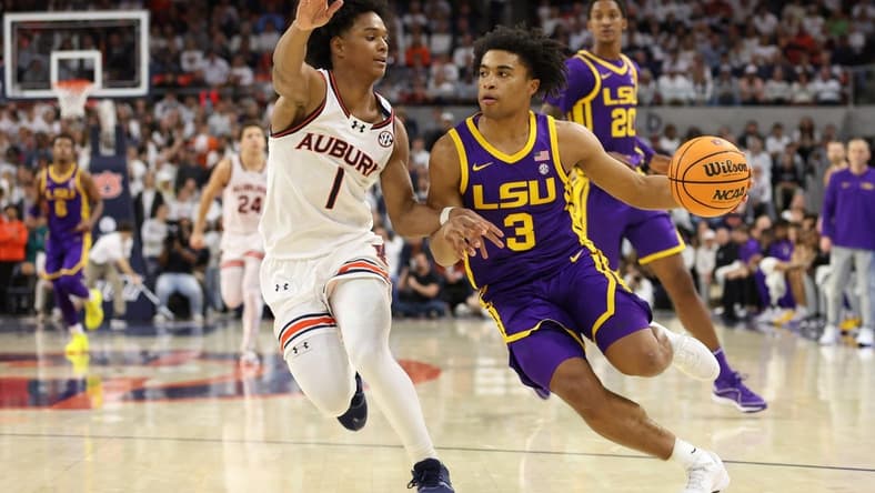 Jan 13, 2024; Auburn, Alabama, USA; Auburn Tigers guard Aden Holloway (1) pressures LSU Tigers guard Jalen Cook (3) during the first half at Neville Arena. Mandatory Credit: John Reed-USA TODAY Sports