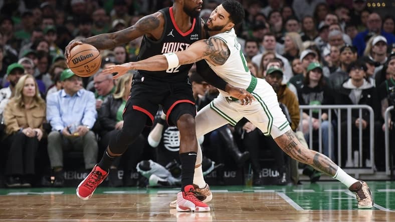 Jan 13, 2024; Boston, Massachusetts, USA; Houston Rockets forward Jeff Green (32) controls the ball away from Boston Celtics forward Jayson Tatum (0) during the first half at TD Garden. Mandatory Credit: Bob DeChiara-USA TODAY Sports