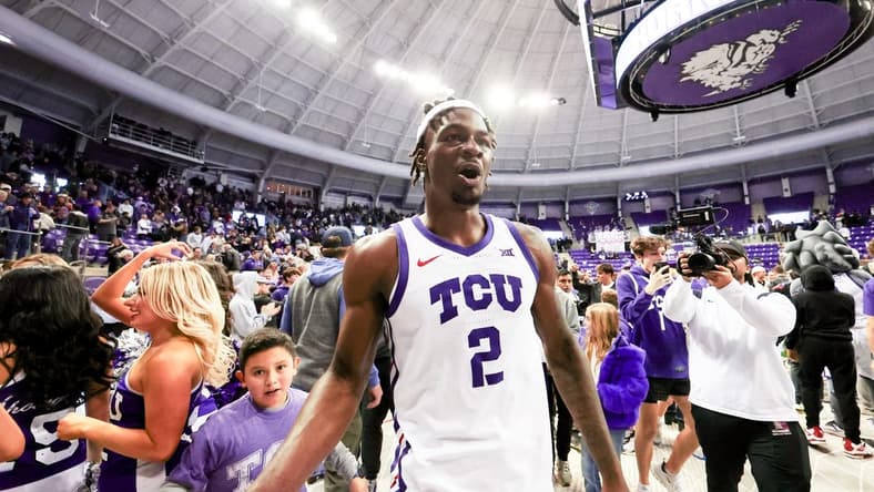 Jan 13, 2024; Fort Worth, Texas, USA; TCU Horned Frogs forward Emanuel Miller (2) celebrates with fans after the game against the Houston Cougars at Ed and Rae Schollmaier Arena. Mandatory Credit: Kevin Jairaj-USA TODAY Sports